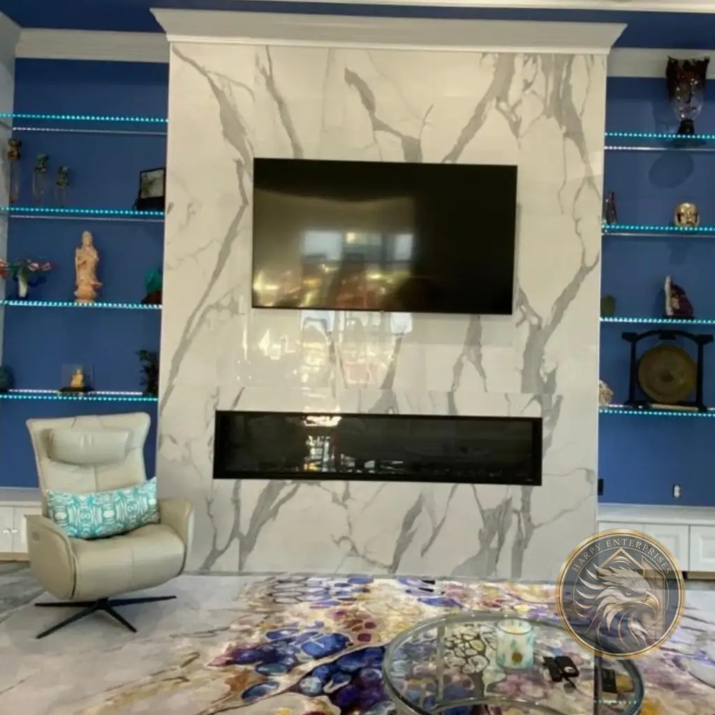 Fireplace surround finished with large-format marble-look porcelain tile in the Lorenzo Residence project