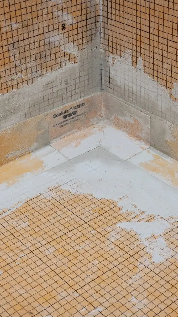 Schluter KERDI waterproofing membrane with sealed seams and inside corners installed in a shower before tile in Cape Coral