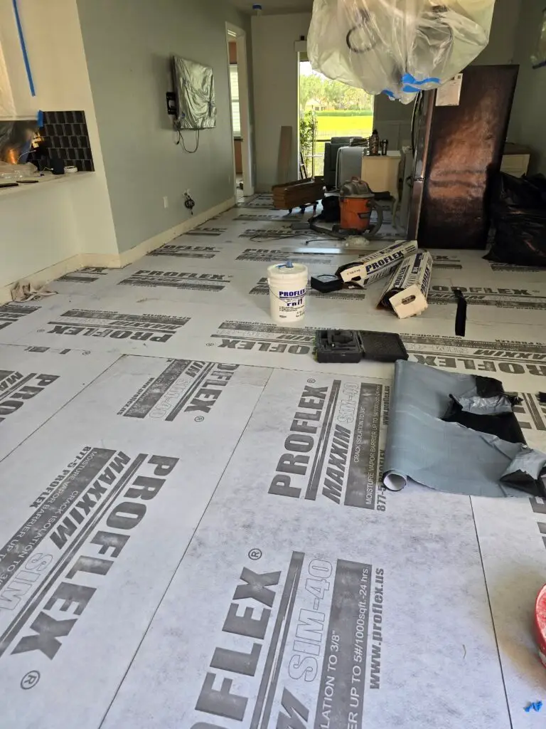 PROFLEX MAXXIM SIM-40 underlayment membrane rolled out across a prepared floor before porcelain tile installation in Ave Maria